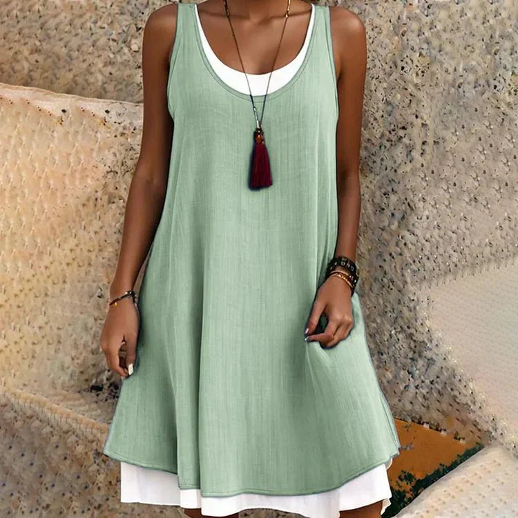 Cove | Abito midi smanicato luminoso