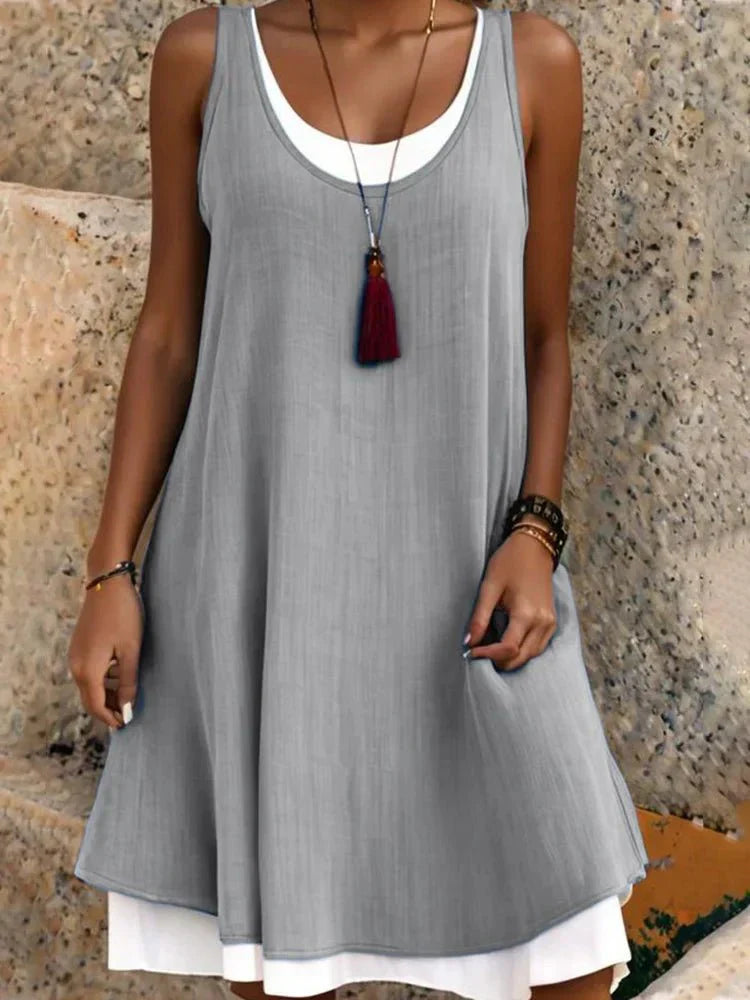 Cove | Abito midi smanicato luminoso