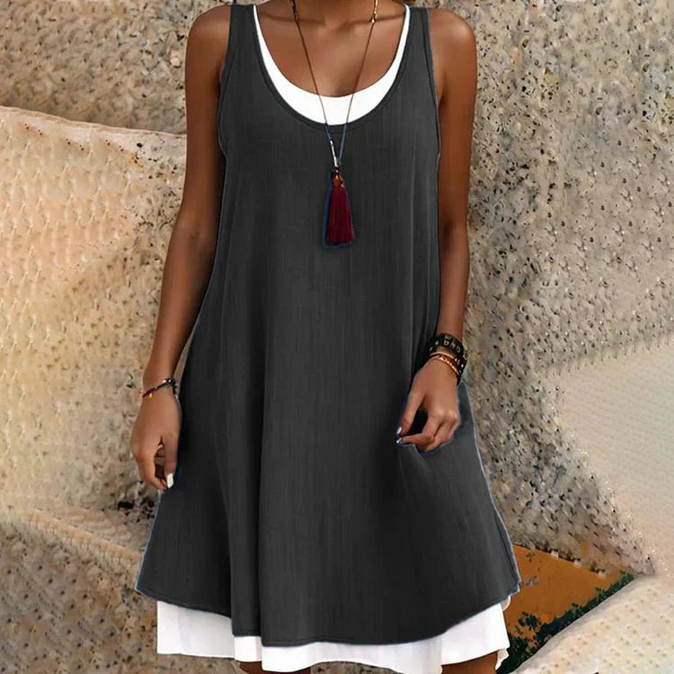 Cove | Abito midi smanicato luminoso